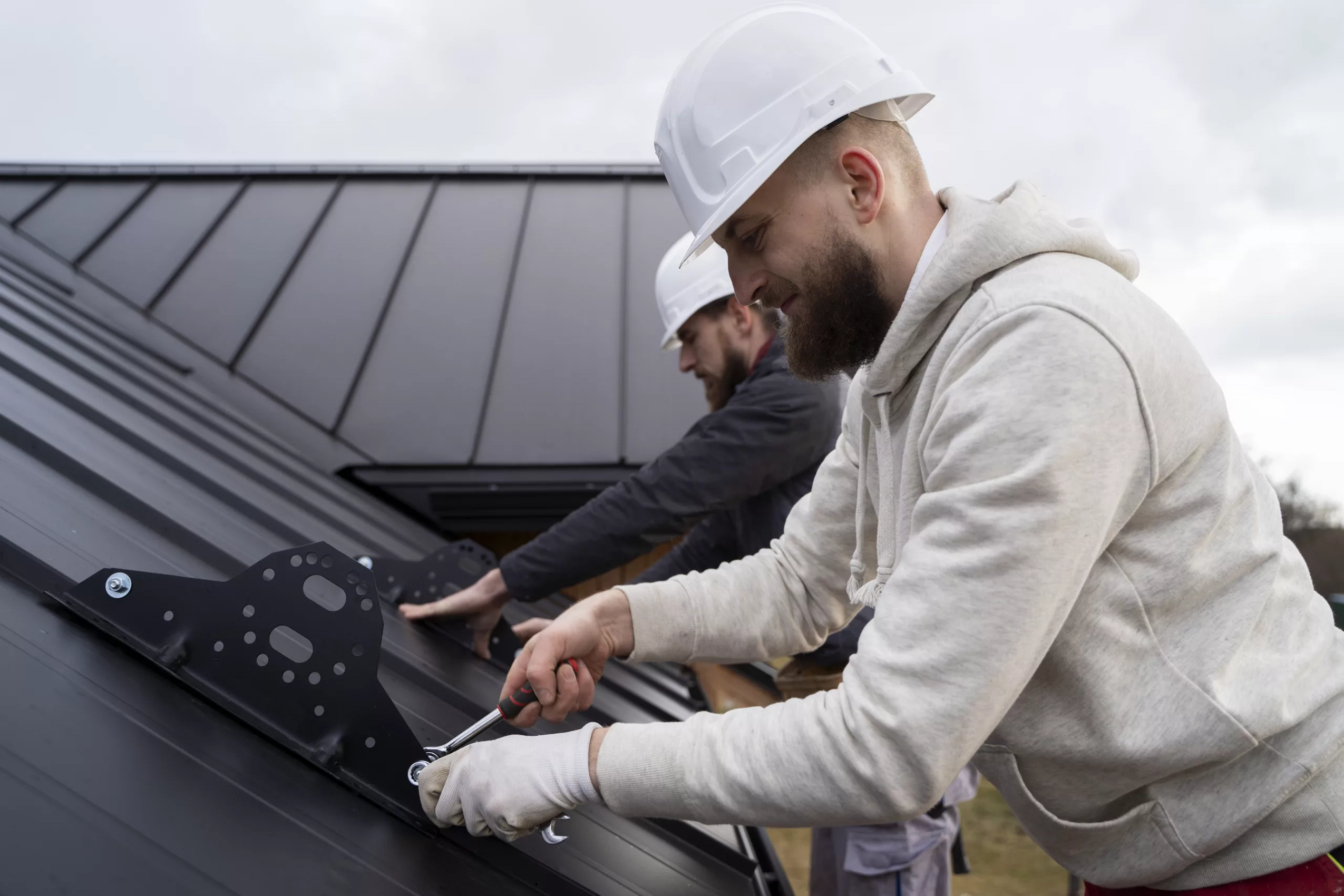 Expert roofing contractors installing a customized roofing system on a commercial building.